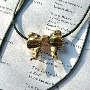 Urban Outfitters Golden Bow on a Black Cord Necklace UO jewelry